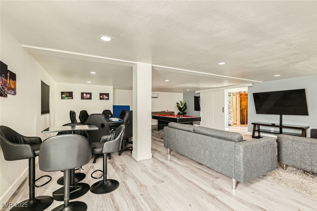 2520 Castlesands Way Las Vegas, NV 89121 - Photo 24 of 59 Living area with light wood-style flooring, recessed lighting, billiards table, and a textured ceiling