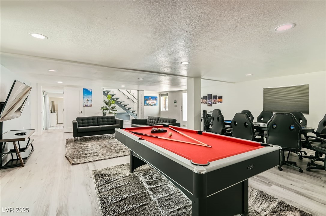 2520 Castlesands Way Las Vegas, NV 89121 - Photo 25 of 59 Game room with light wood-style flooring, pool table, a textured ceiling, and recessed lighting