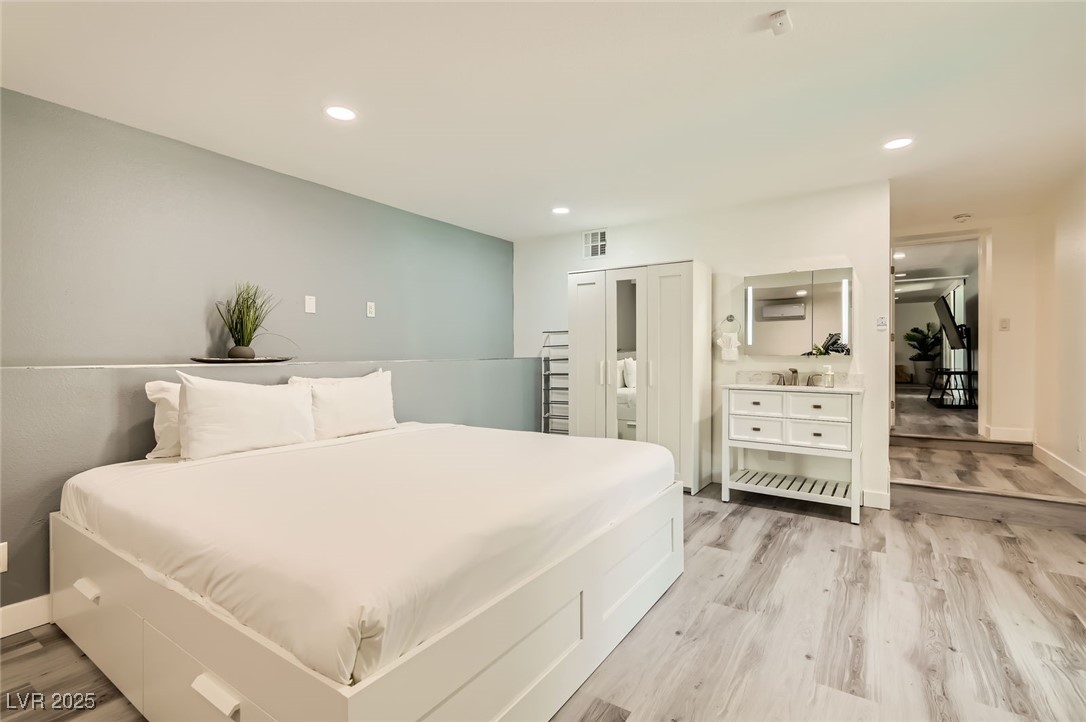 2520 Castlesands Way Las Vegas, NV 89121 - Photo 30 of 59 Bedroom featuring light wood finished floors and recessed lighting