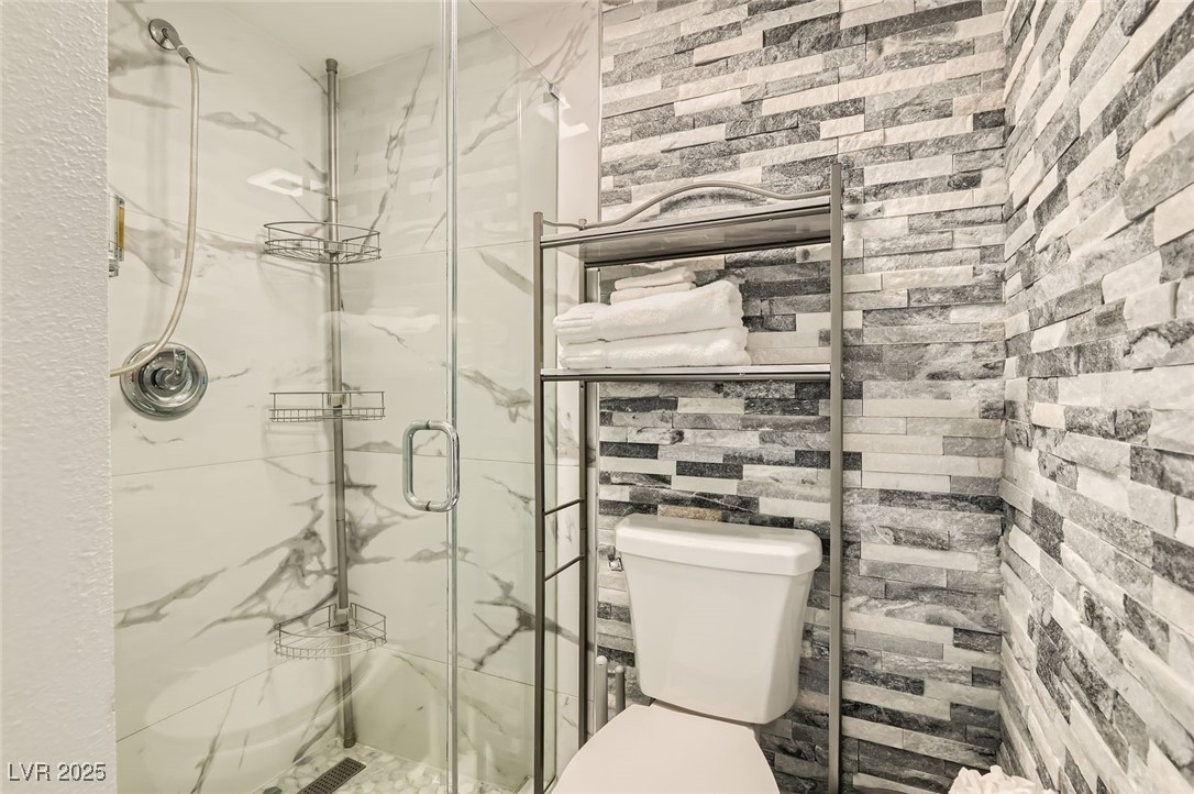 2520 Castlesands Way Las Vegas, NV 89121 - Photo 33 of 59 Bathroom featuring a marble finish shower and toilet