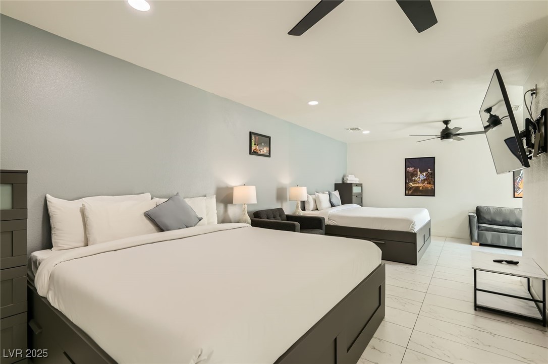 2520 Castlesands Way Las Vegas, NV 89121 - Photo 34 of 59 Bedroom featuring light marble finish floors, recessed lighting, and ceiling fan