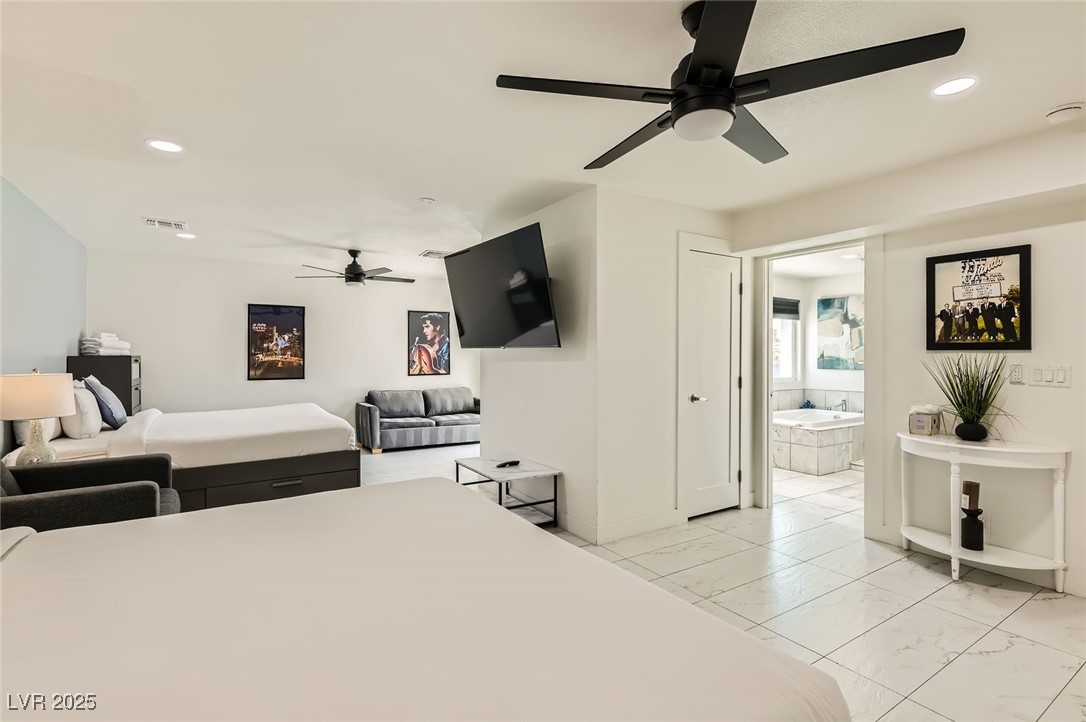 2520 Castlesands Way Las Vegas, NV 89121 - Photo 36 of 59 Bedroom with recessed lighting, light marble finish floors, ensuite bath, and a ceiling fan