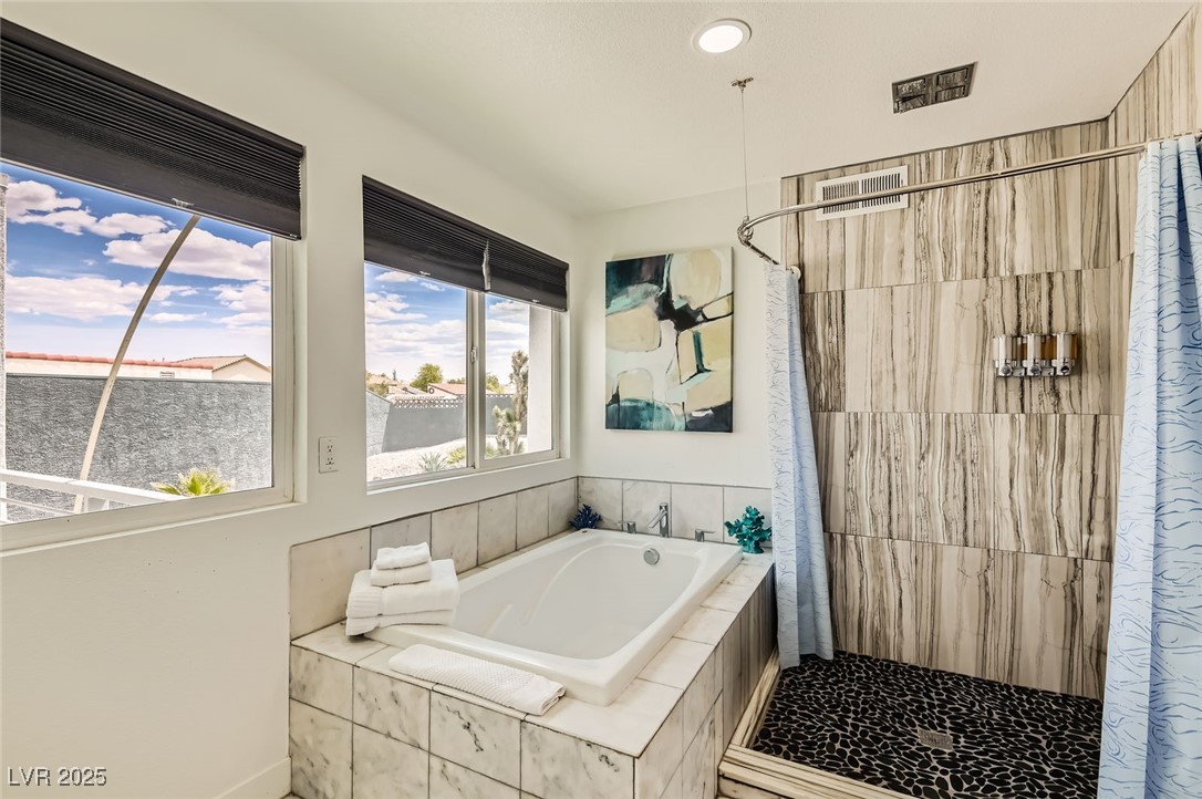 2520 Castlesands Way Las Vegas, NV 89121 - Photo 37 of 59 Bathroom featuring a stall shower and a garden tub