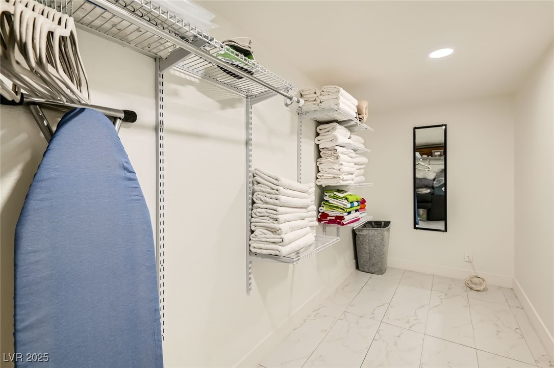 2520 Castlesands Way Las Vegas, NV 89121 - Photo 39 of 59 Spacious closet with marble look tile flooring