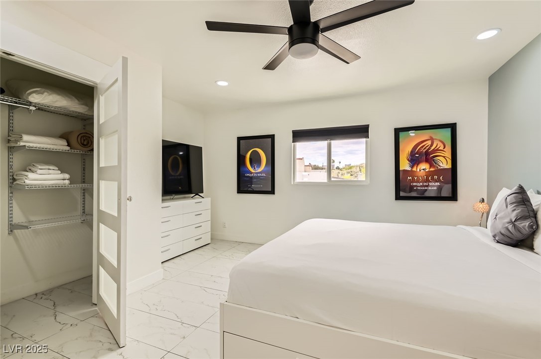 2520 Castlesands Way Las Vegas, NV 89121 - Photo 40 of 59 Bedroom with light marble finish flooring, recessed lighting, and ceiling fan