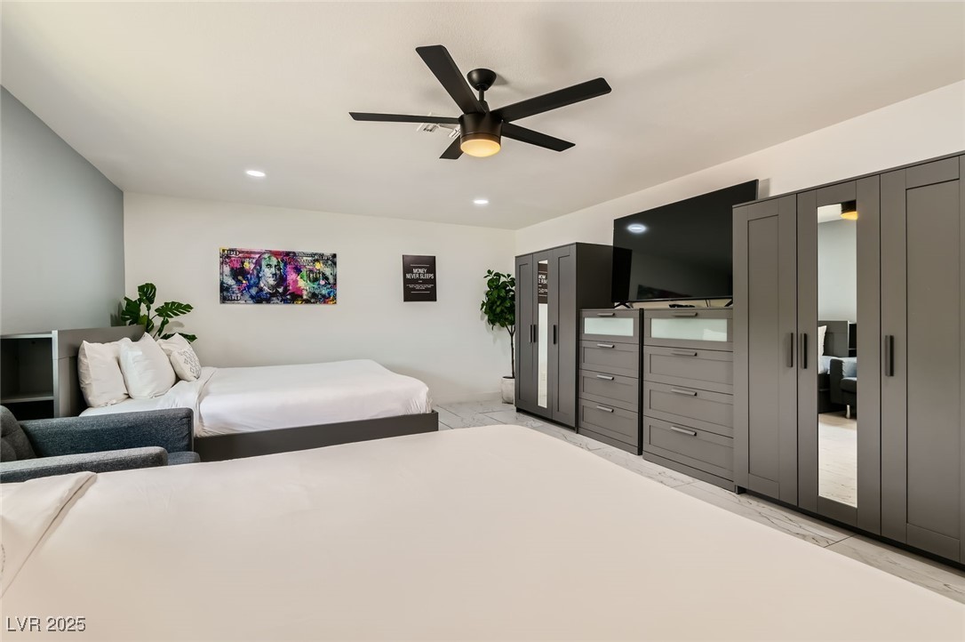 2520 Castlesands Way Las Vegas, NV 89121 - Photo 43 of 59 Bedroom featuring light marble finish floors, recessed lighting, and ceiling fan