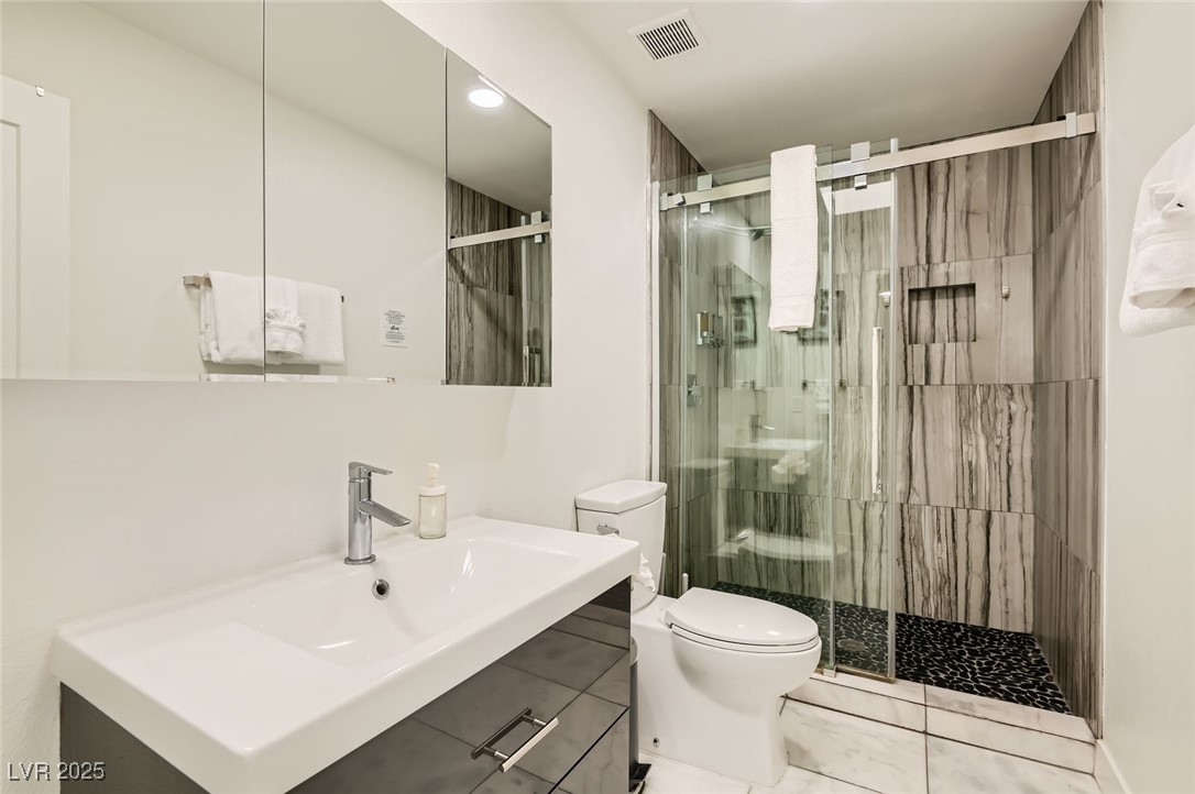 2520 Castlesands Way Las Vegas, NV 89121 - Photo 44 of 59 Bathroom with a shower stall and vanity