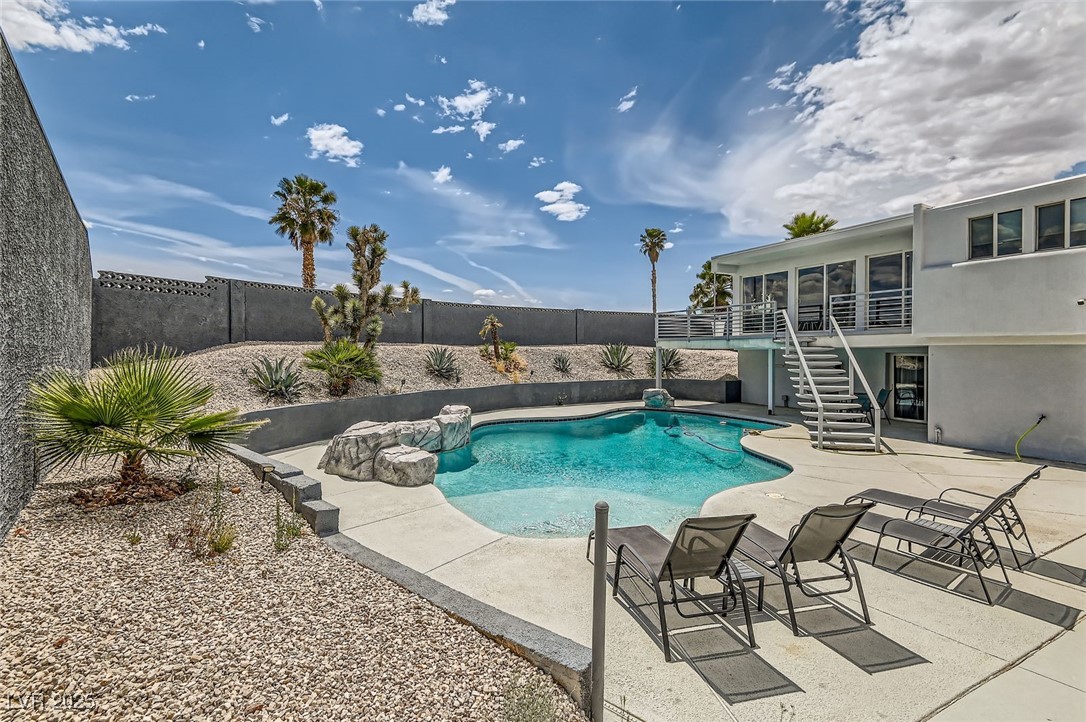 2520 Castlesands Way Las Vegas, NV 89121 - Photo 52 of 59 View of swimming pool with stairs, a fenced backyard, and a patio