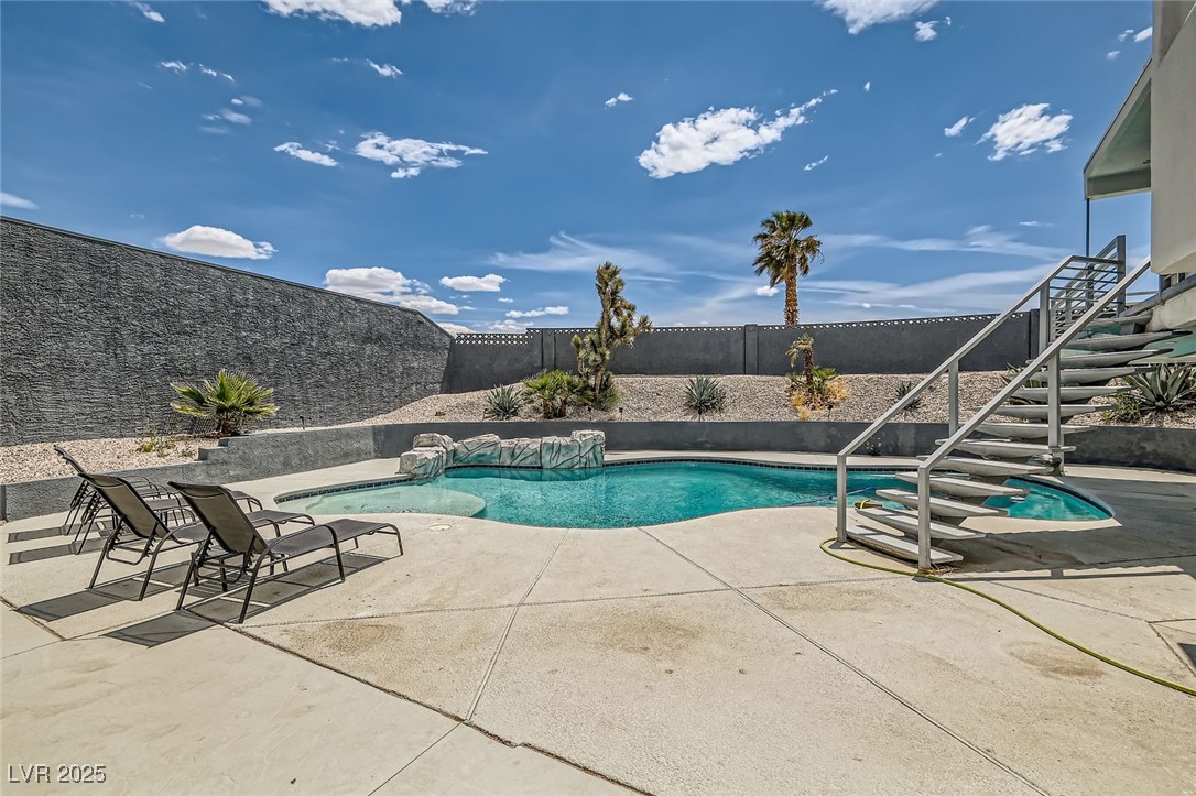 2520 Castlesands Way Las Vegas, NV 89121 - Photo 54 of 59 View of pool featuring a fenced backyard, stairs, and a patio area