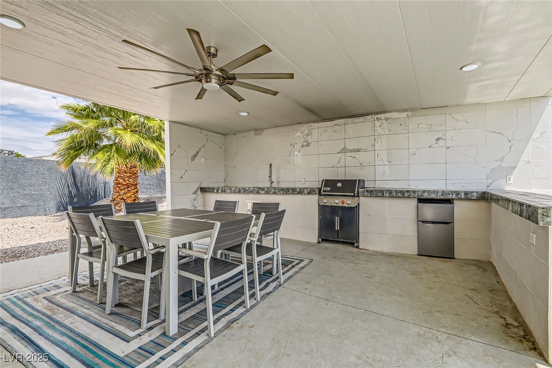 2520 Castlesands Way Las Vegas, NV 89121 - Photo 55 of 59 View of patio with area for grilling, ceiling fan, and outdoor dining space