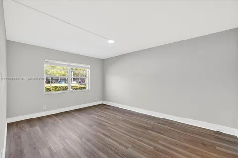 a spacious bathroom with a double vanity sink and a mirror