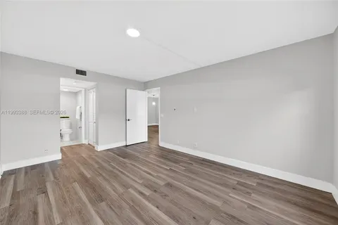 a bathroom with a sink vanity and a mirror
