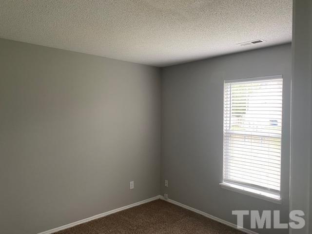 4405 Jordan Oaks Way Raleigh, NC 27604 - Photo 14 of 20 a view of an empty room with a window