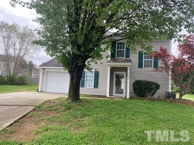 4405 Jordan Oaks Way Raleigh, NC 27604 - Photo 2 of 20 a front view of a house with a yard and garage