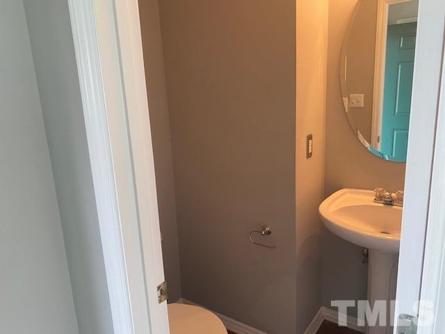 4405 Jordan Oaks Way Raleigh, NC 27604 - Photo 5 of 20 a bathroom with a toilet and a sink