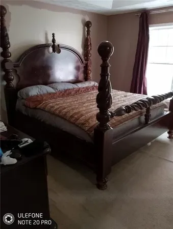 a view of room with furniture and a potted plant