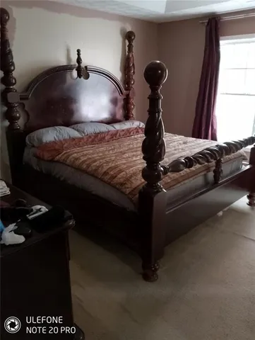 a view of room with furniture and a potted plant