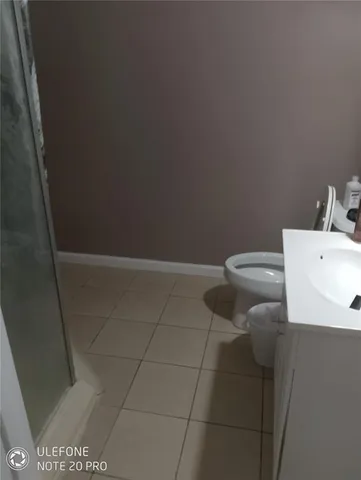 a living room with furniture and floor to ceiling window