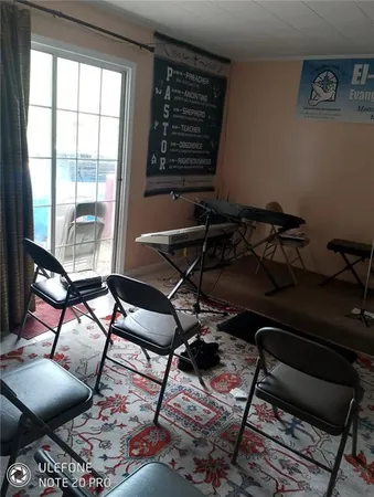 a room with gym equipment and a large window