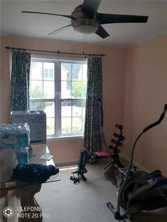 a bath tub sitting next to a window