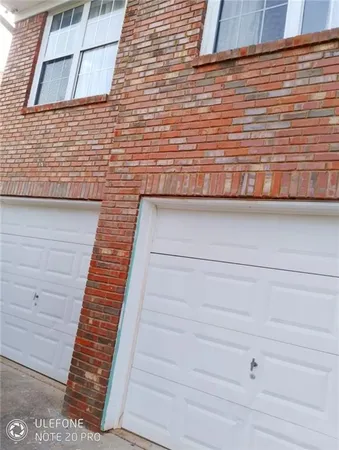 a bathroom with a granite countertop bathtub shower sink and toilet