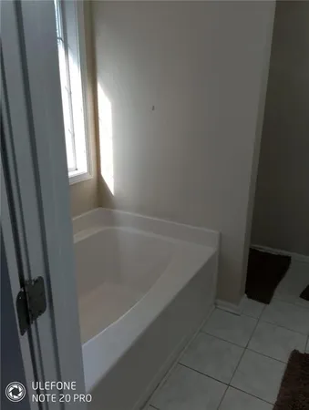 a bathroom with a bathtub