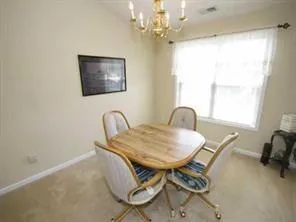 a workspace with furniture and window