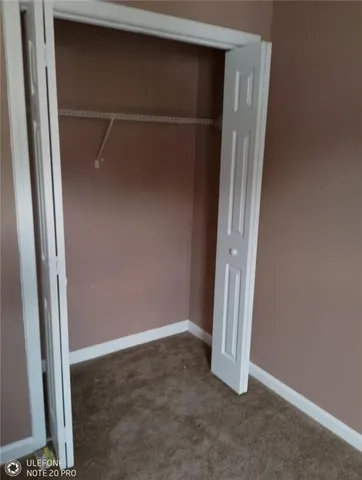 a view of a chairs and table in the balcony