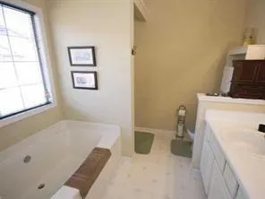 a bathroom with a bathtub sink and toilet