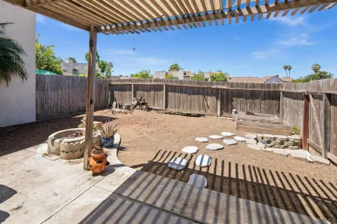 a view of a roof deck with furniture