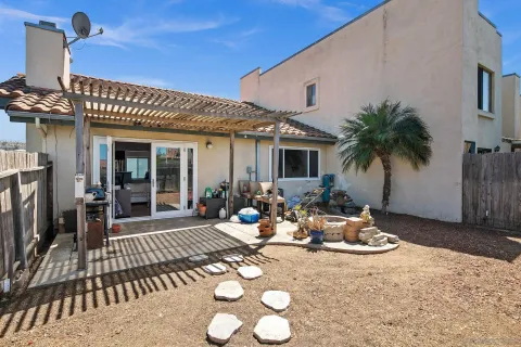 a view of a chairs and table in the patio