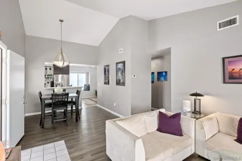 a living room with furniture a window and a table