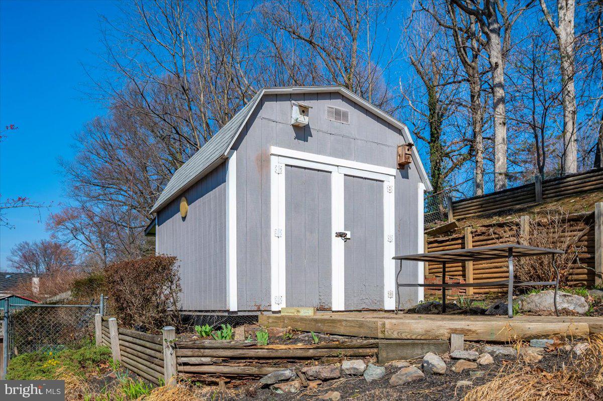 11852 Huggins Drive Silver Spring, MD 20902 - Photo 44 of 63 Charming shed nestled in nature's embrace.