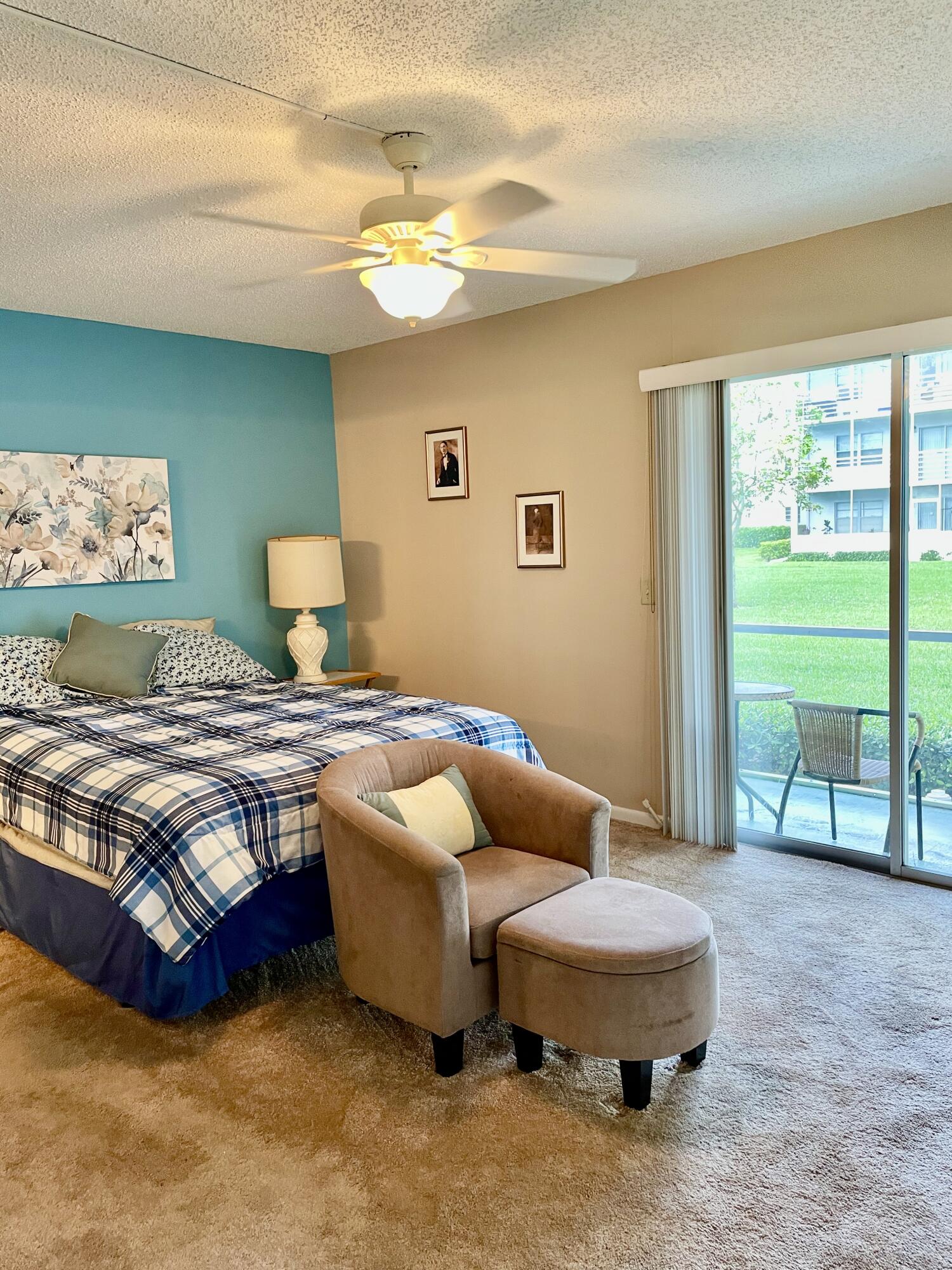 296 Preston H Boca Raton, FL 33434 - Photo 12 of 21 a bedroom with a bed and large windows