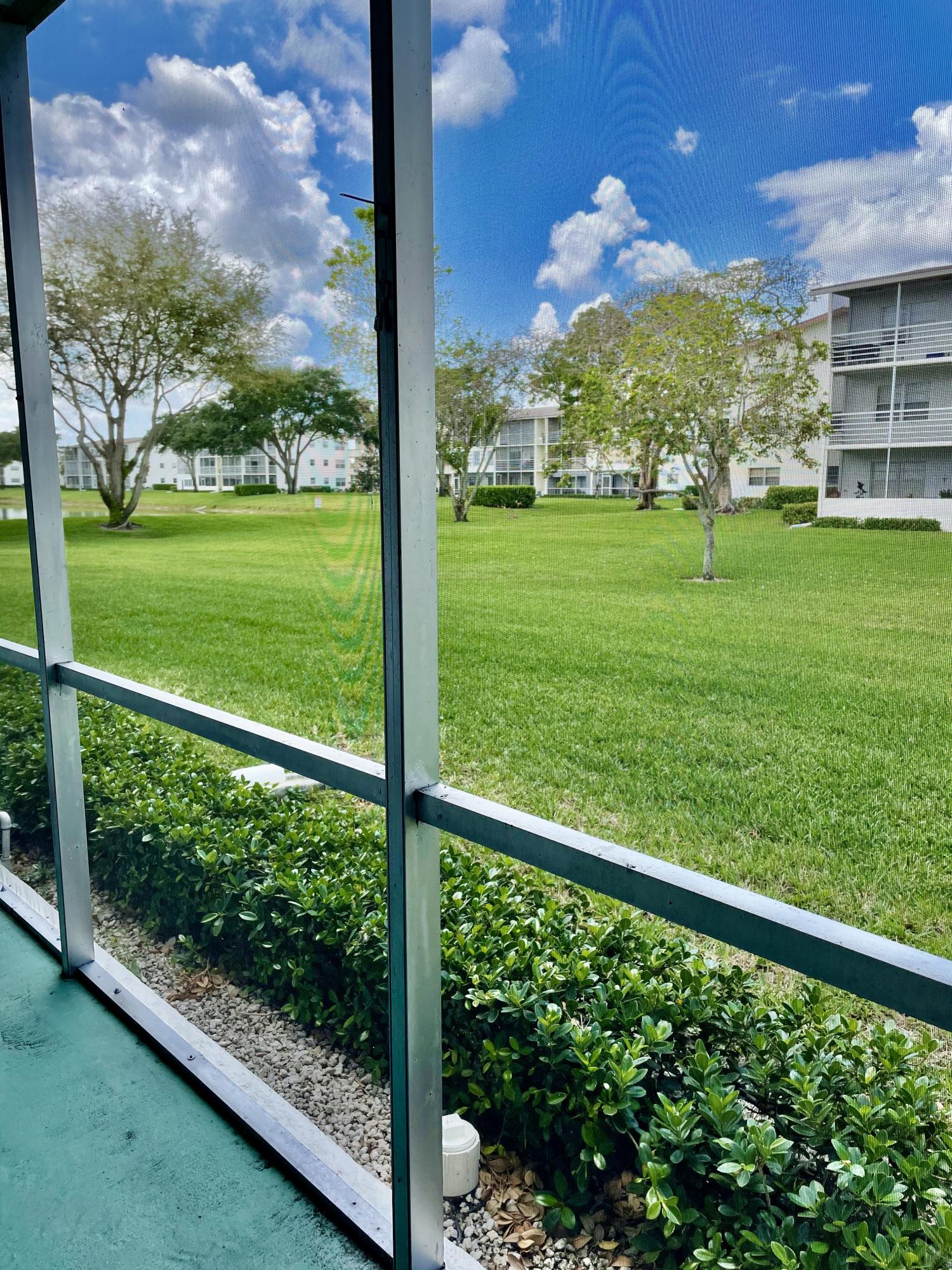 296 Preston H Boca Raton, FL 33434 - Photo 17 of 21 a view of a garden from a window