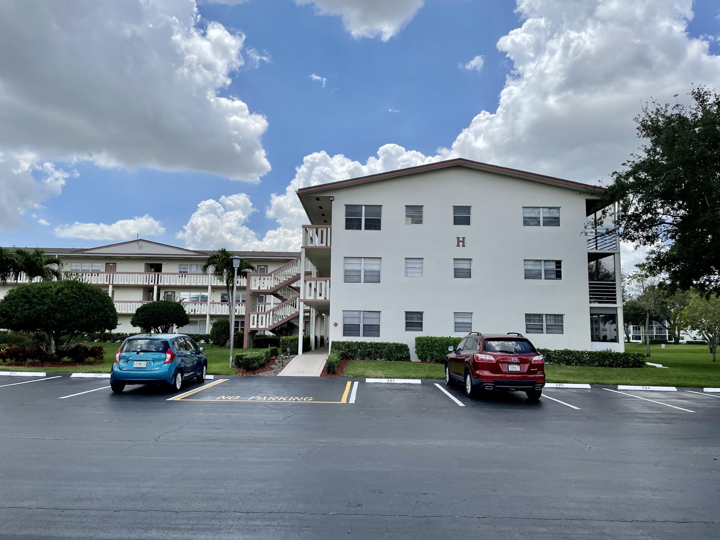 296 Preston H Boca Raton, FL 33434 - Photo 21 of 21 a car parked in front of a house