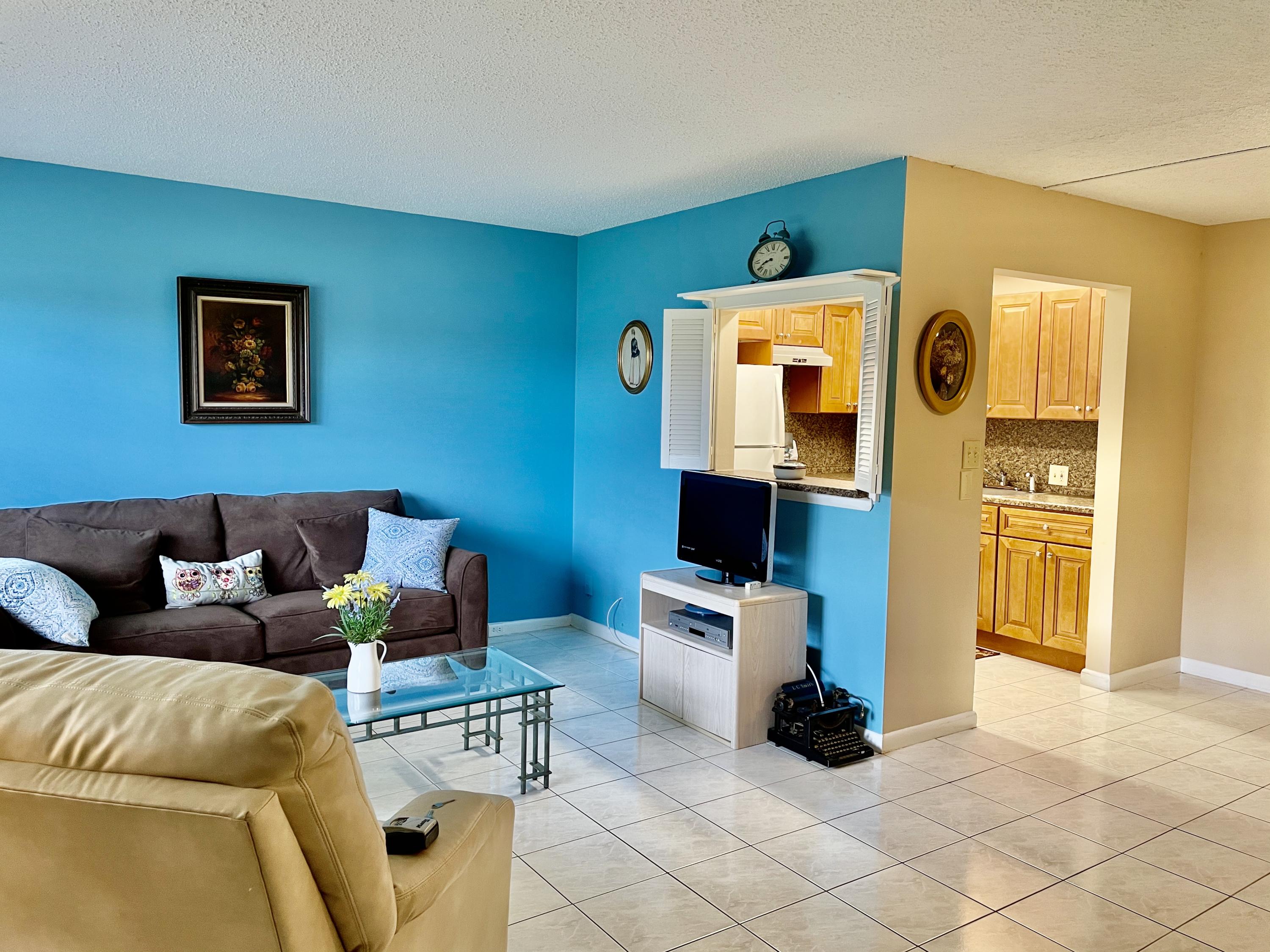 296 Preston H Boca Raton, FL 33434 - Photo 3 of 21 a living room with furniture and a table