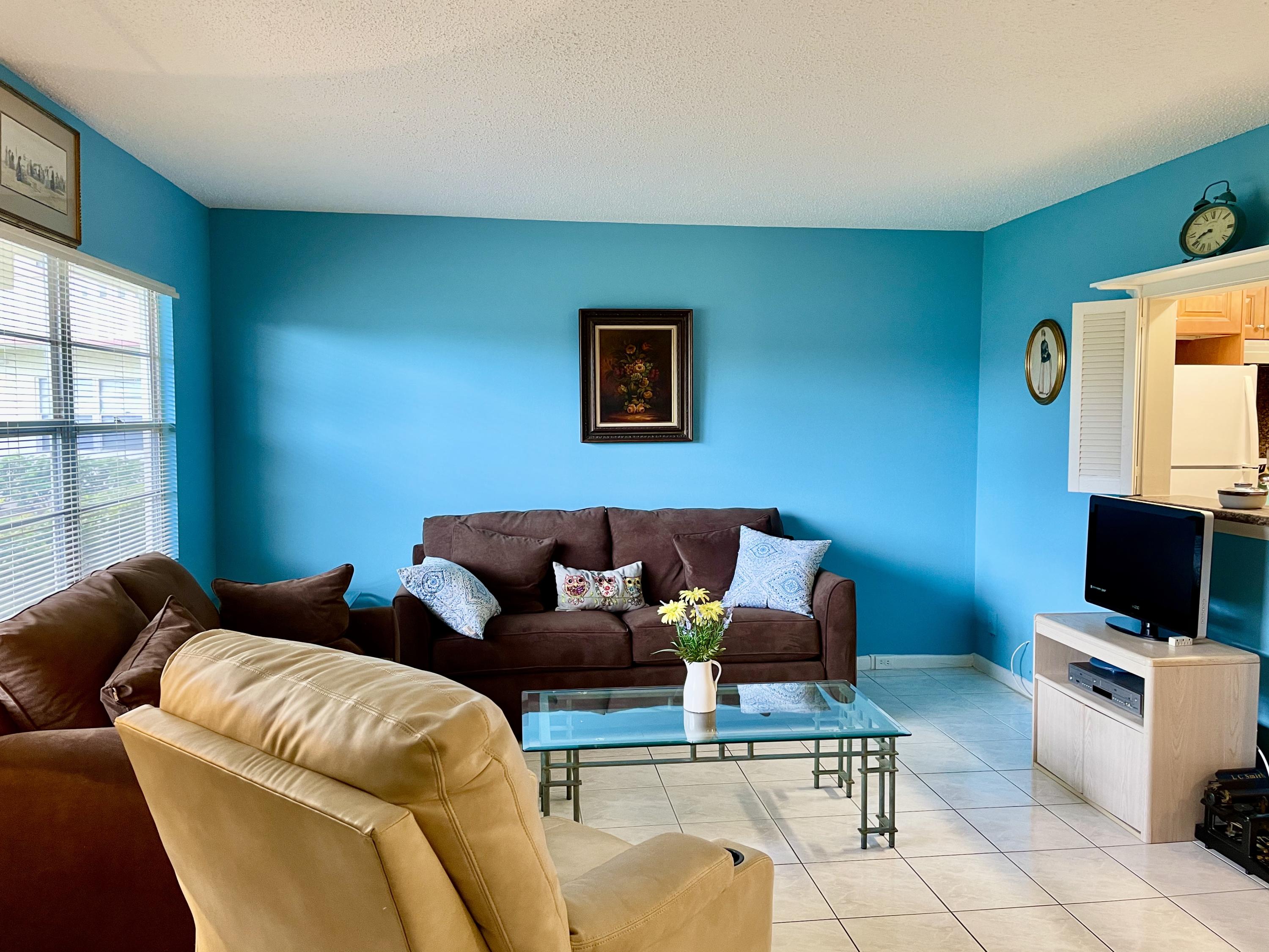 296 Preston H Boca Raton, FL 33434 - Photo 4 of 21 a living room with furniture and a flat screen tv