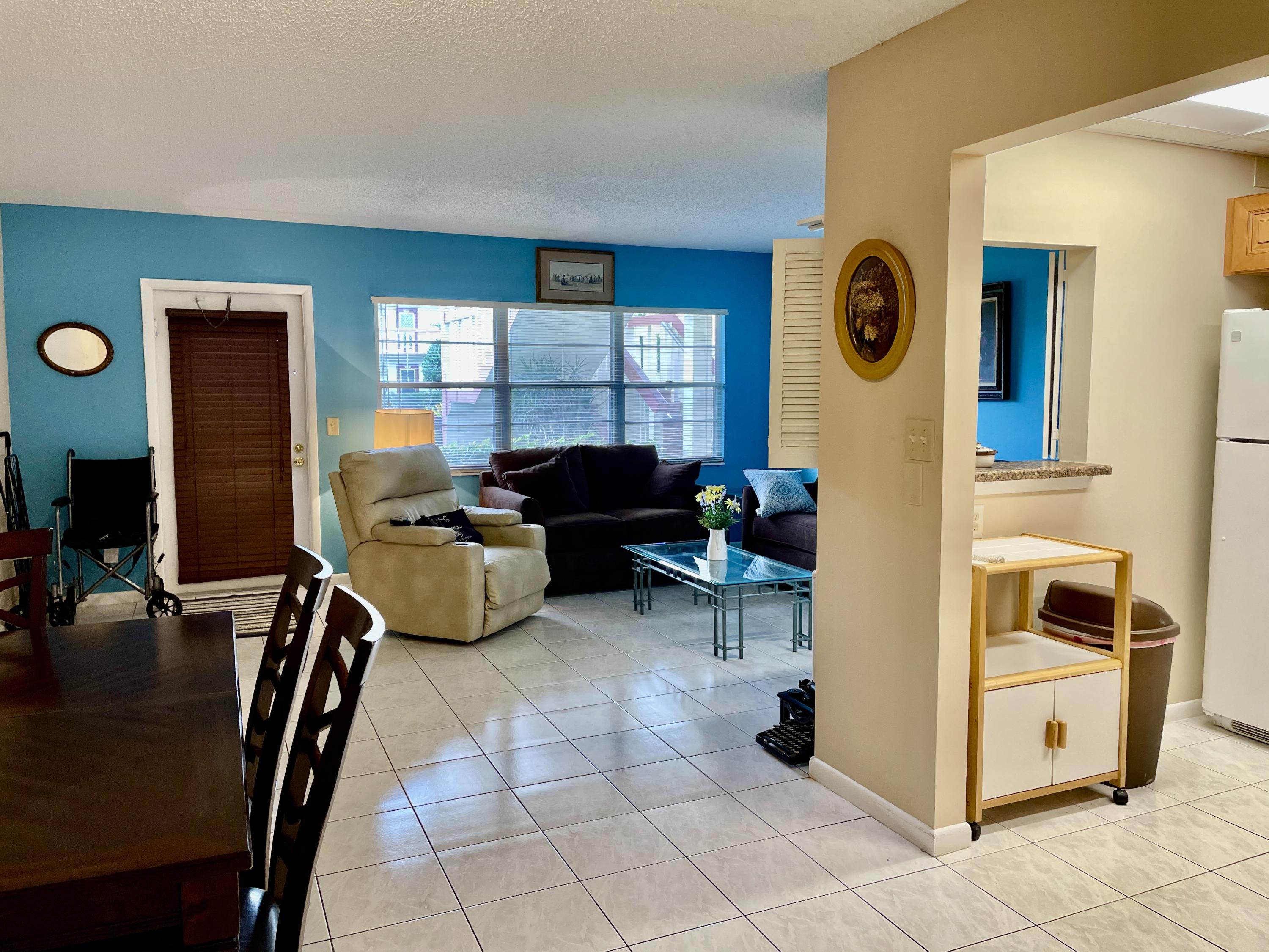 296 Preston H Boca Raton, FL 33434 - Photo 5 of 21 a view of a livingroom with furniture and window