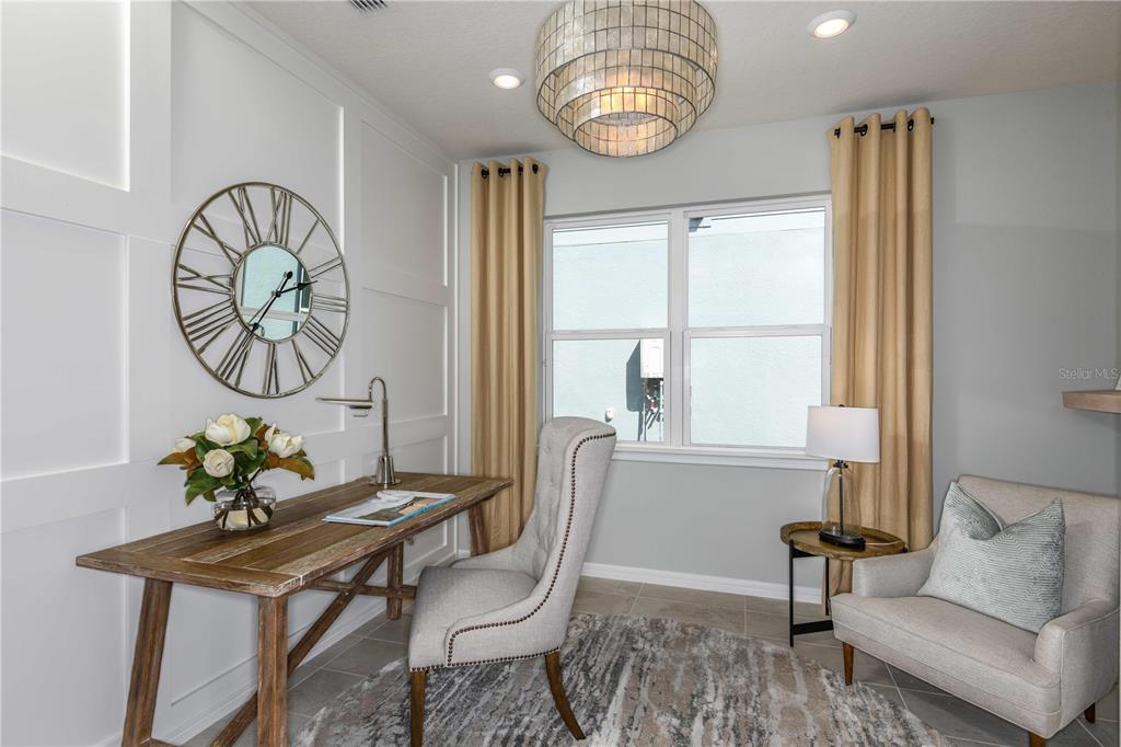 2362 Daisy Tree Road St. Cloud, FL 34771 - Photo 23 of 31 a living room with furniture a table and a window