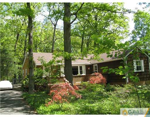 125 Clyde Road Somerset, NJ 08873 - Photo 1 of 13 front view of a house with a yard