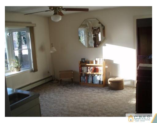 125 Clyde Road Somerset, NJ 08873 - Photo 5 of 13 a view of livingroom with furniture and windows