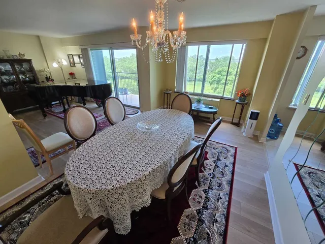 a view of a dining room with furniture and window
