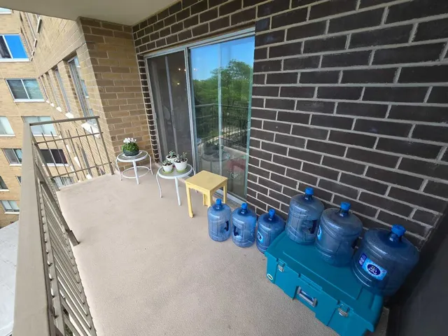 a view of a hallway and wooden floor