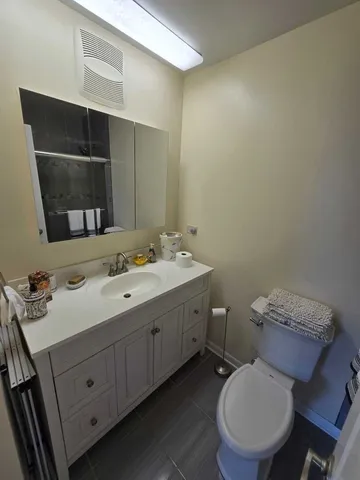 a bathroom with a toilet and a sink