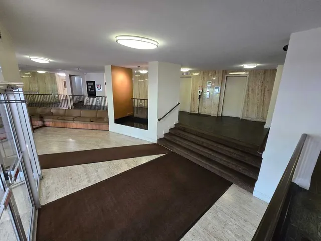 a view of room with wooden floor