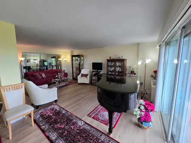 a view of a livingroom with furniture and workspace