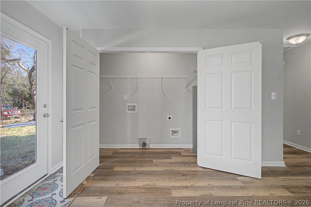 214 Lee Street Spring Lake, NC 28390 - Photo 17 of 44 a view of a livingroom with wooden floor and a bathroom