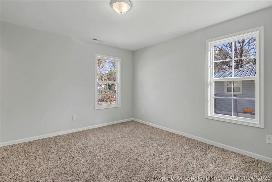214 Lee Street Spring Lake, NC 28390 - Photo 25 of 44 an empty room with windows