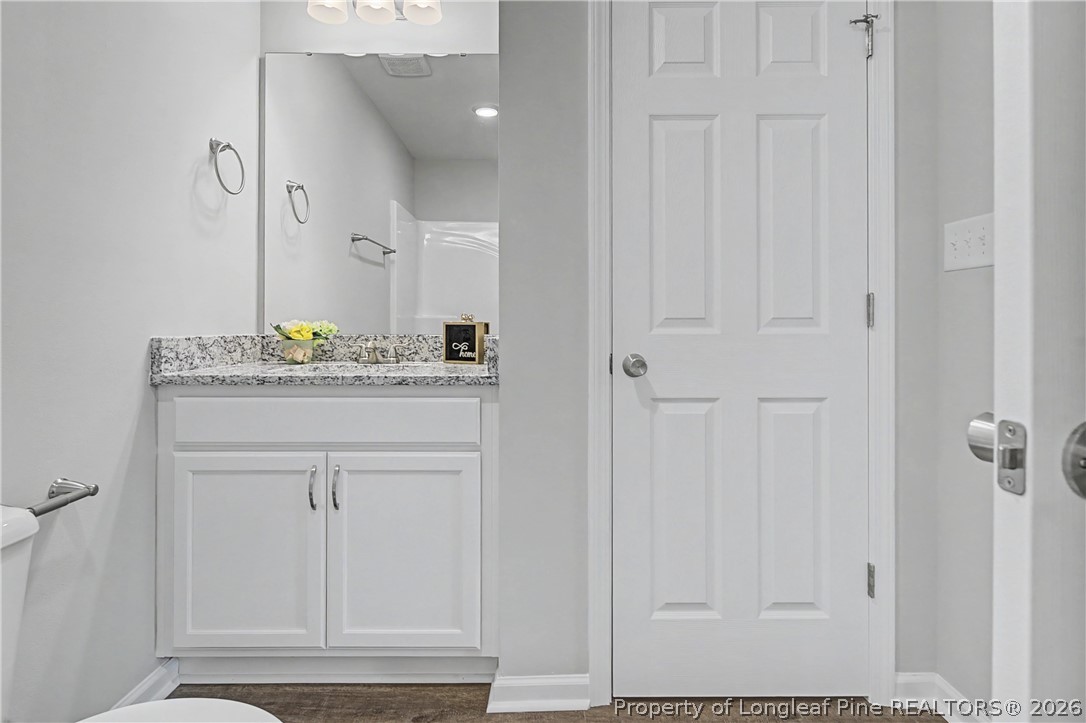 214 Lee Street Spring Lake, NC 28390 - Photo 36 of 44 a bathroom with a sink and vanity